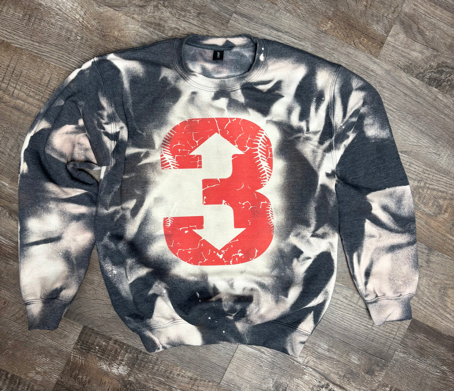 Light-colored baseball-themed bleached sweatshirt from Liv's Boutique with "3 up 3 down" graphic on the front.