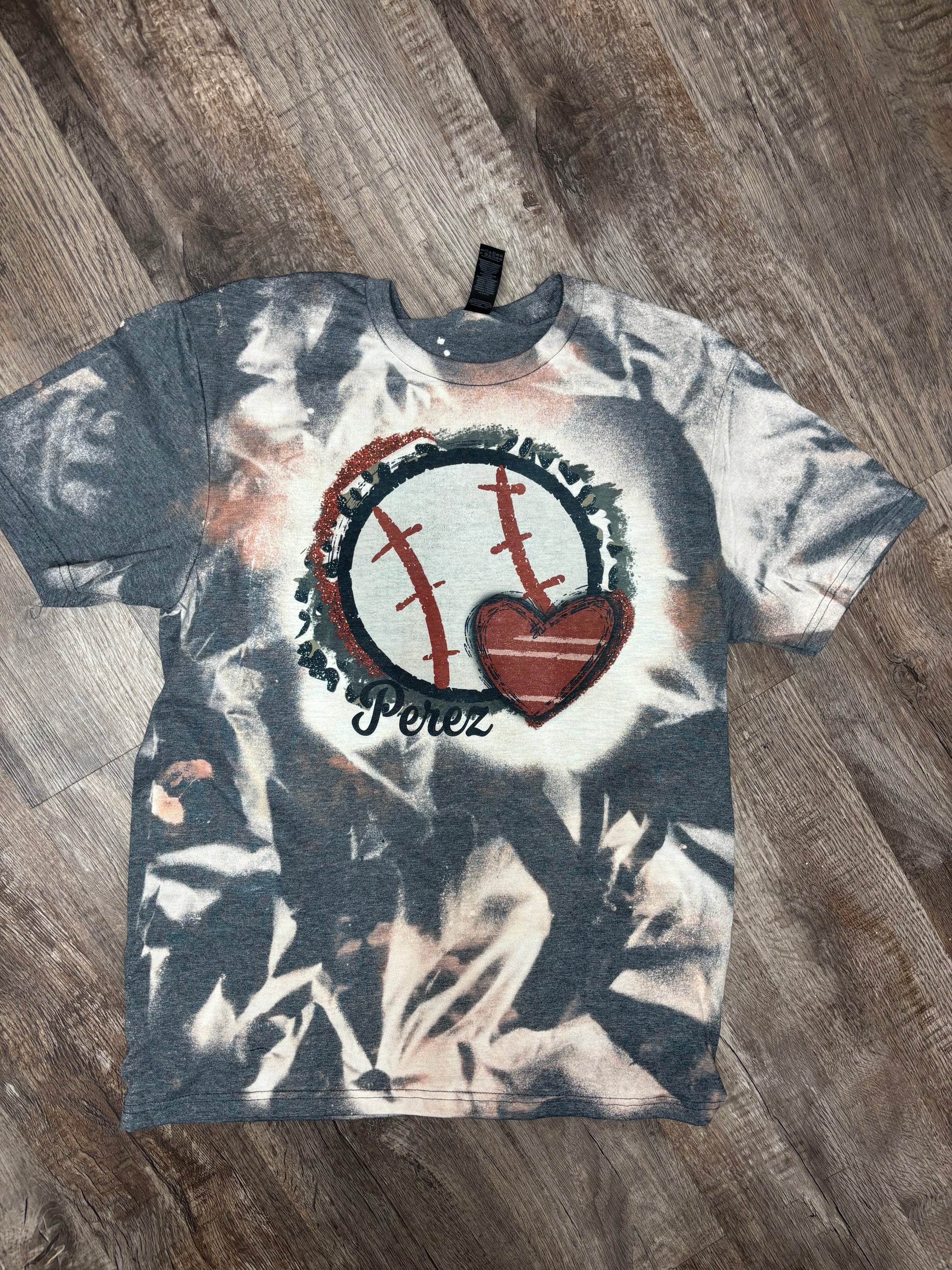 Custom bleached baseball mom T-shirt from Liv's Boutique featuring team name and number on front, casual and stylish design.