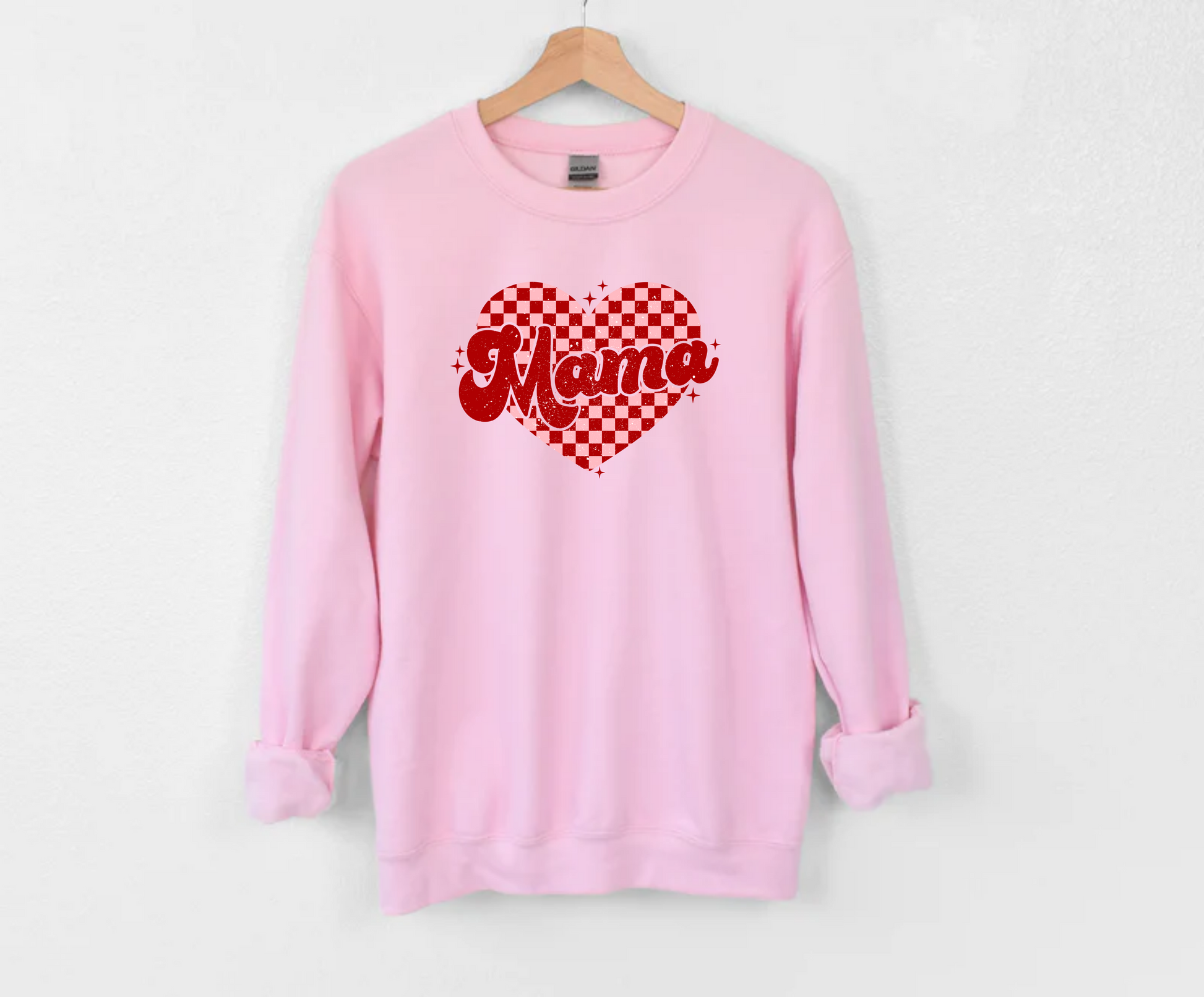 Mama Valentine Checkered Heart Graphic on a Pink Crewneck Sweatshirt