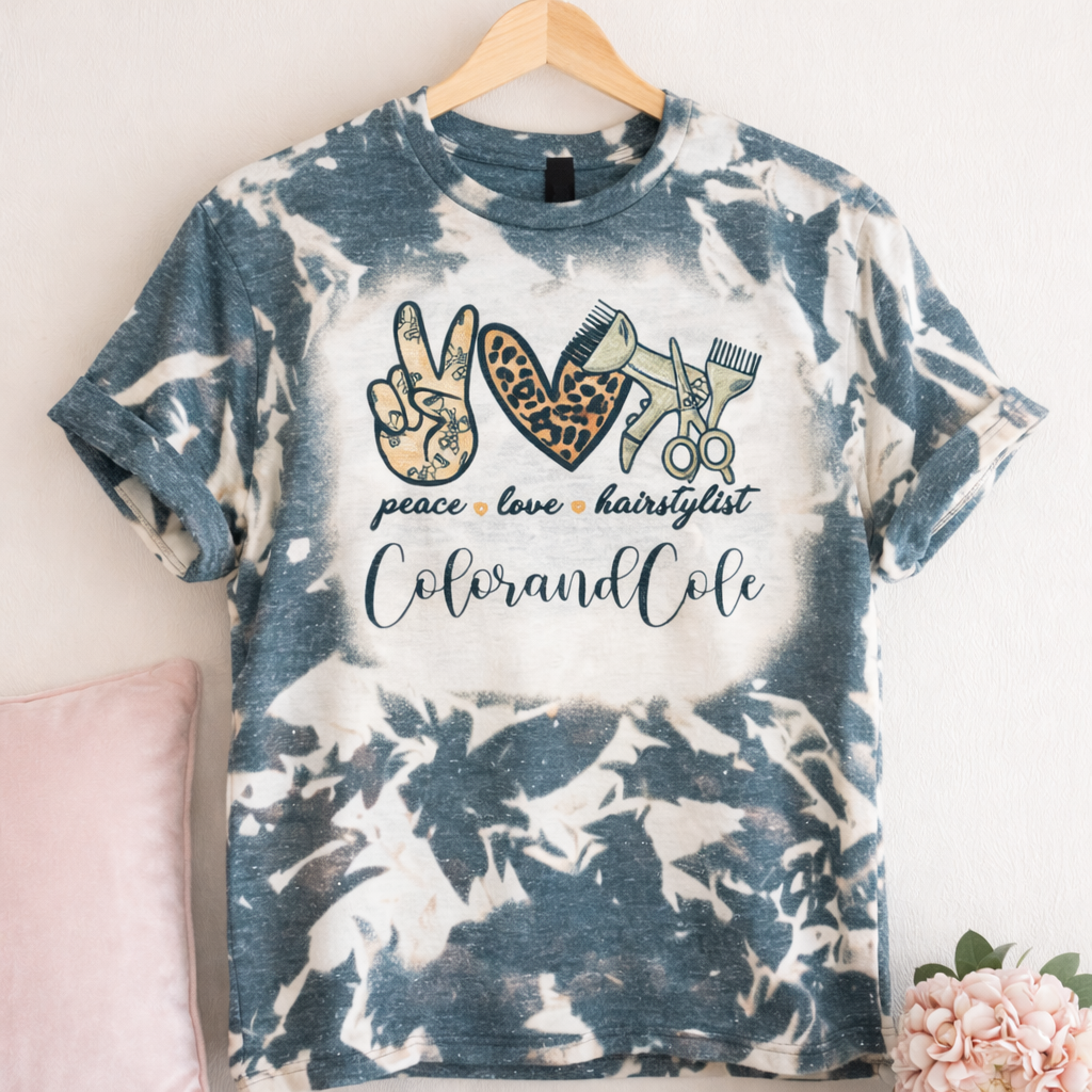 Peace Love Hairstylist bleached T-shirt from Liv's Boutique featuring a hair salon mock-up design on a casual tee.